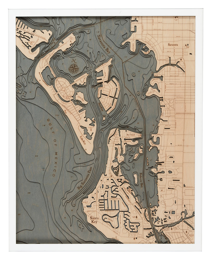 Siesta Key, Florida 3D layered wood map in laser-cut Baltic birch, shown framed against a light wall