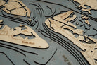 Siesta Key, Florida 3D layered wood map in laser-cut Baltic birch, shown framed against a light wall
