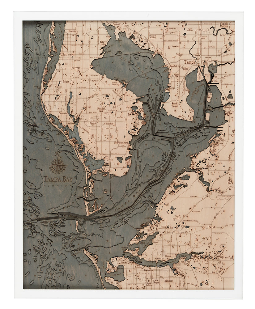 Tampa Bay, Florida 3D layered wood map in laser-cut Baltic birch, shown framed against a light wall