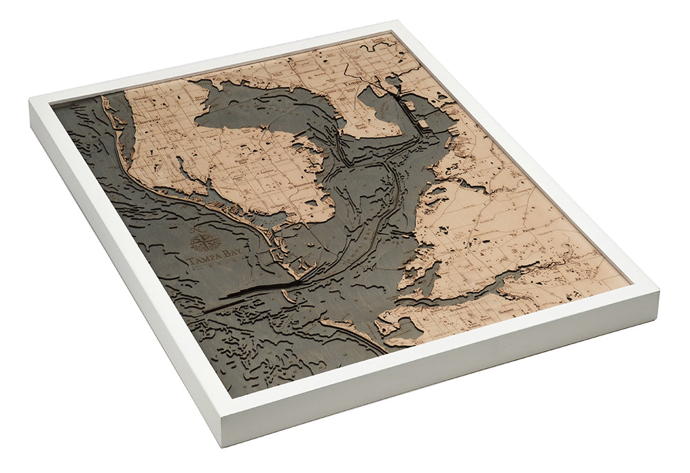 Tampa Bay, Florida 3D layered wood map in laser-cut Baltic birch, shown framed against a light wall