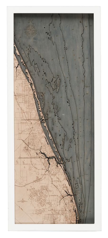 Treasure Coast, Florida 3D layered wood map in laser-cut Baltic birch, shown framed against a light wall