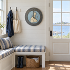 Block Island, Rhode Island wood tide clock hanging on the wall in a cottage mudroom