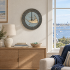 Nantucket, Massachusetts wood tide clock hanging on the wall in a coastal living room