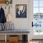 Boothbay Harbor, Maine framed tide and time clock hanging on the wall in a cottage mudroom