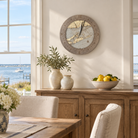 The Hamptons, New York tide and time clock hanging on the wall in a coastal dining room