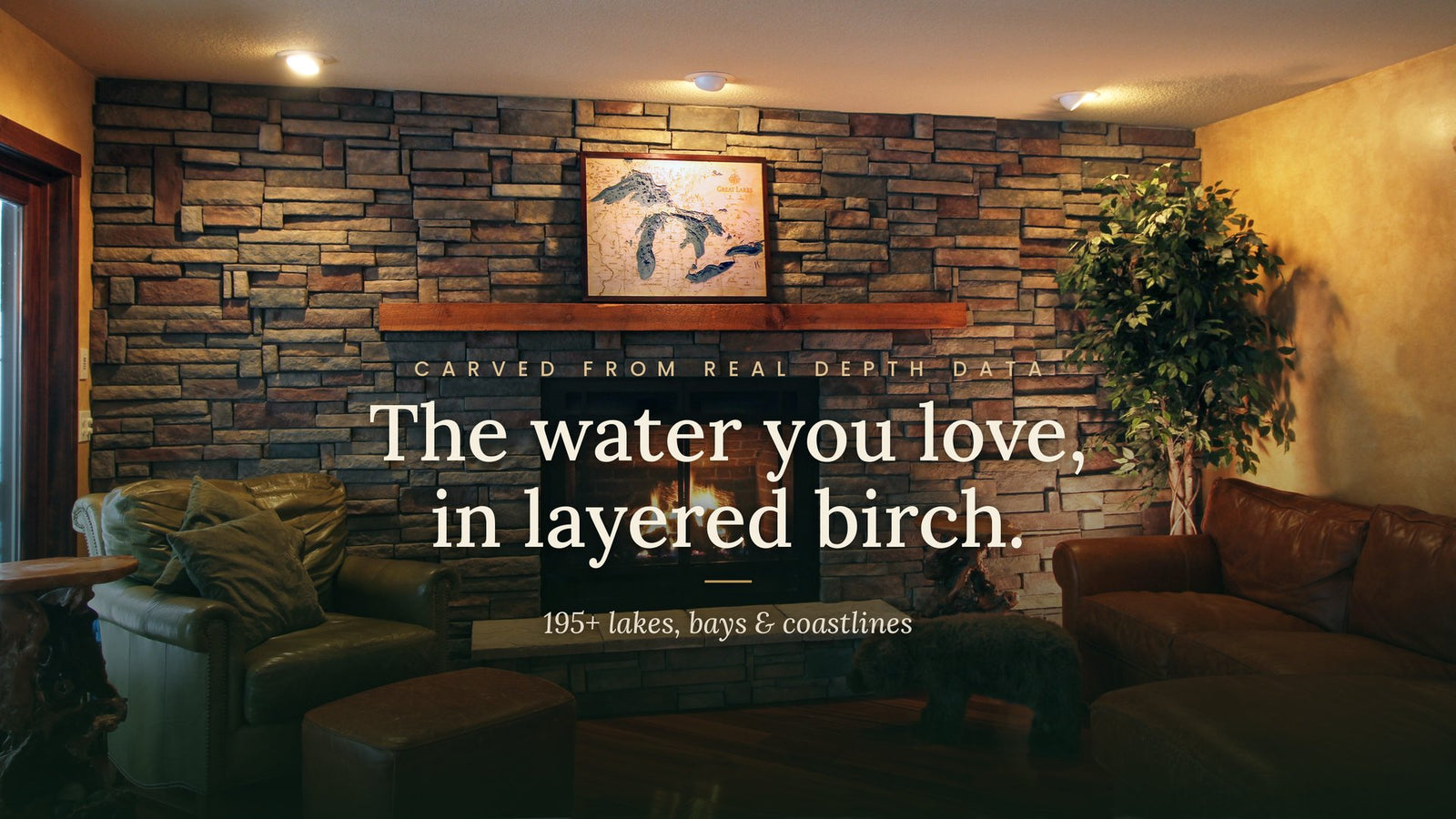 Carved wood lake map above a fireplace