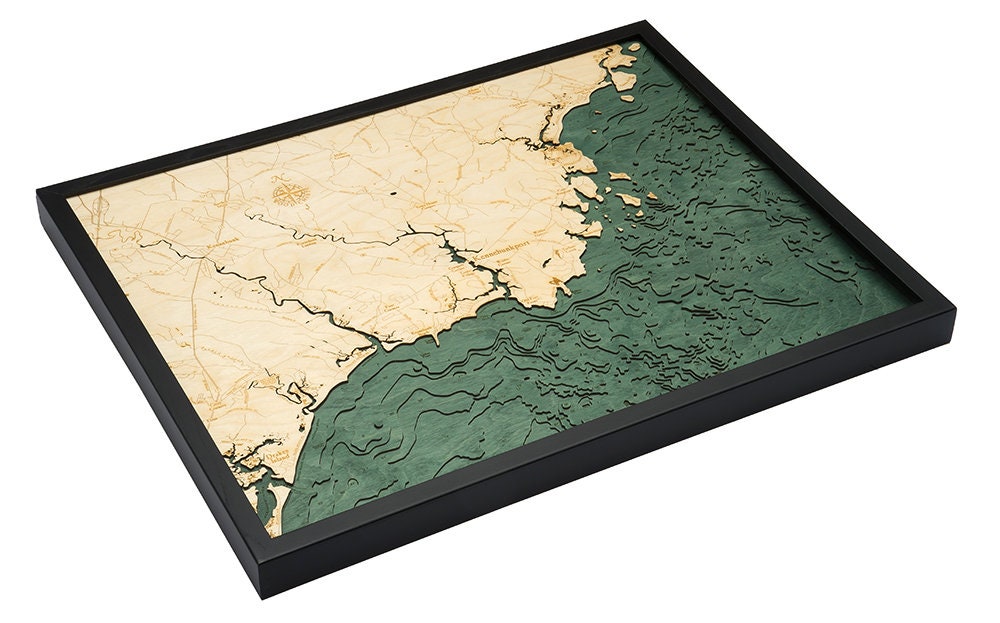 Kennebunkport, Maine 3D layered wood map in laser-cut Baltic birch, shown framed against a light wall