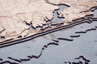 Western Panhandle, Florida 3D layered wood map in laser-cut Baltic birch, shown framed against a light wall