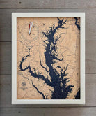 Chesapeake Bay, Maryland wood tide clock in laser-cut Baltic birch, shown framed against a light wall