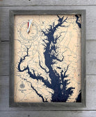 Chesapeake Bay, Maryland wood tide clock in laser-cut Baltic birch, shown framed against a light wall