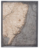 New Jersey Coast 3D layered wood map in laser-cut Baltic birch, shown framed against a light wall