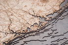 New Jersey Coast 3D layered wood map in laser-cut Baltic birch, shown framed against a light wall