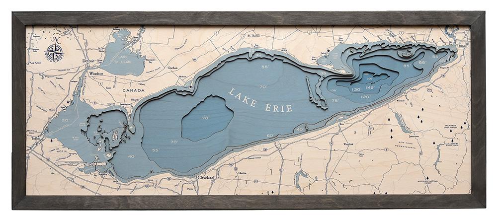 Lake Erie 3D layered wood map in laser-cut Baltic birch, shown framed against a light wall