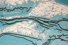 Cape Cod, Massachusetts 3D layered wood map in laser-cut Baltic birch, shown framed against a light wall