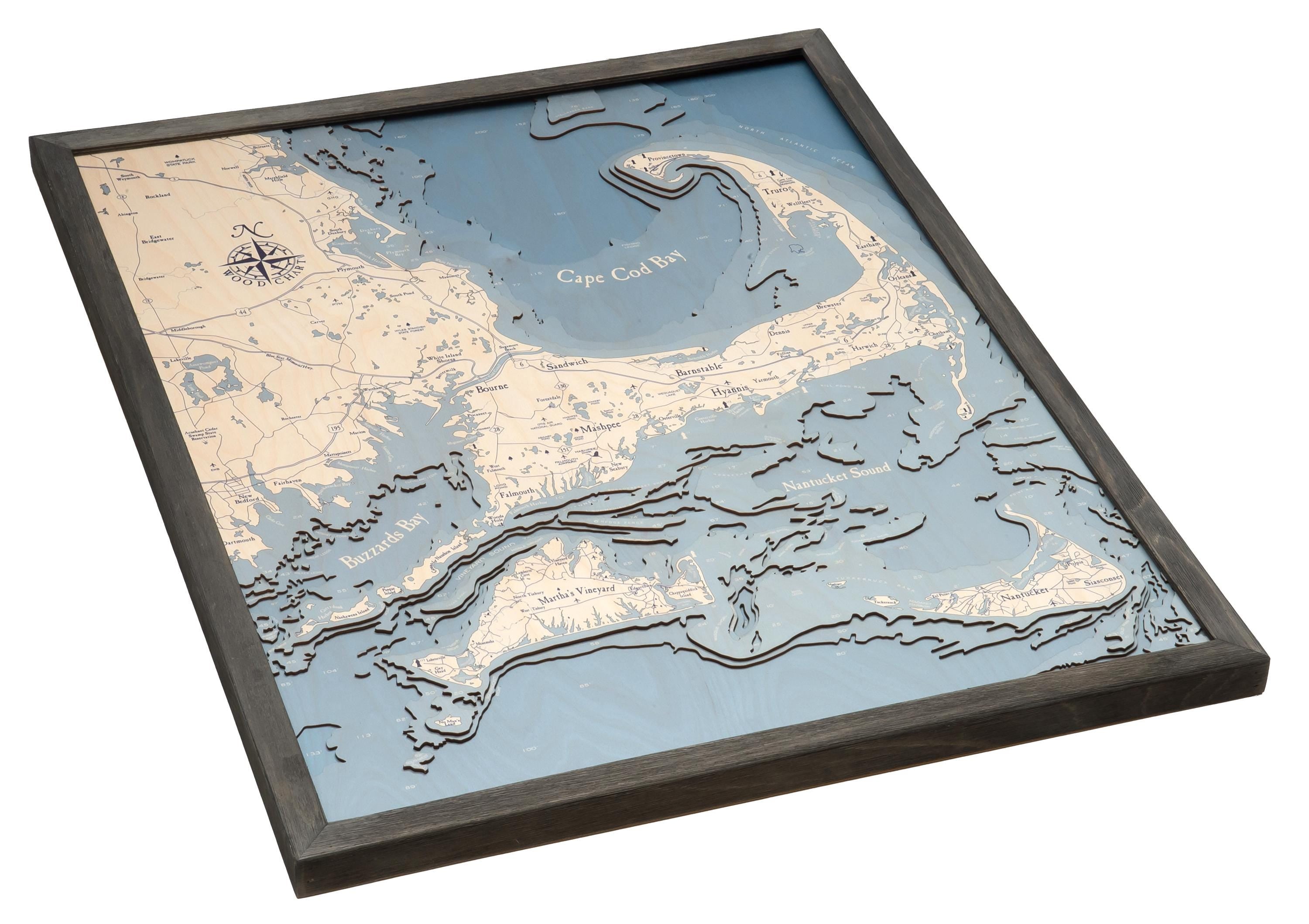 Cape Cod, Massachusetts 3D layered wood map in laser-cut Baltic birch, shown framed against a light wall