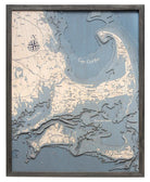 Cape Cod, Massachusetts 3D layered wood map in laser-cut Baltic birch, shown framed against a light wall