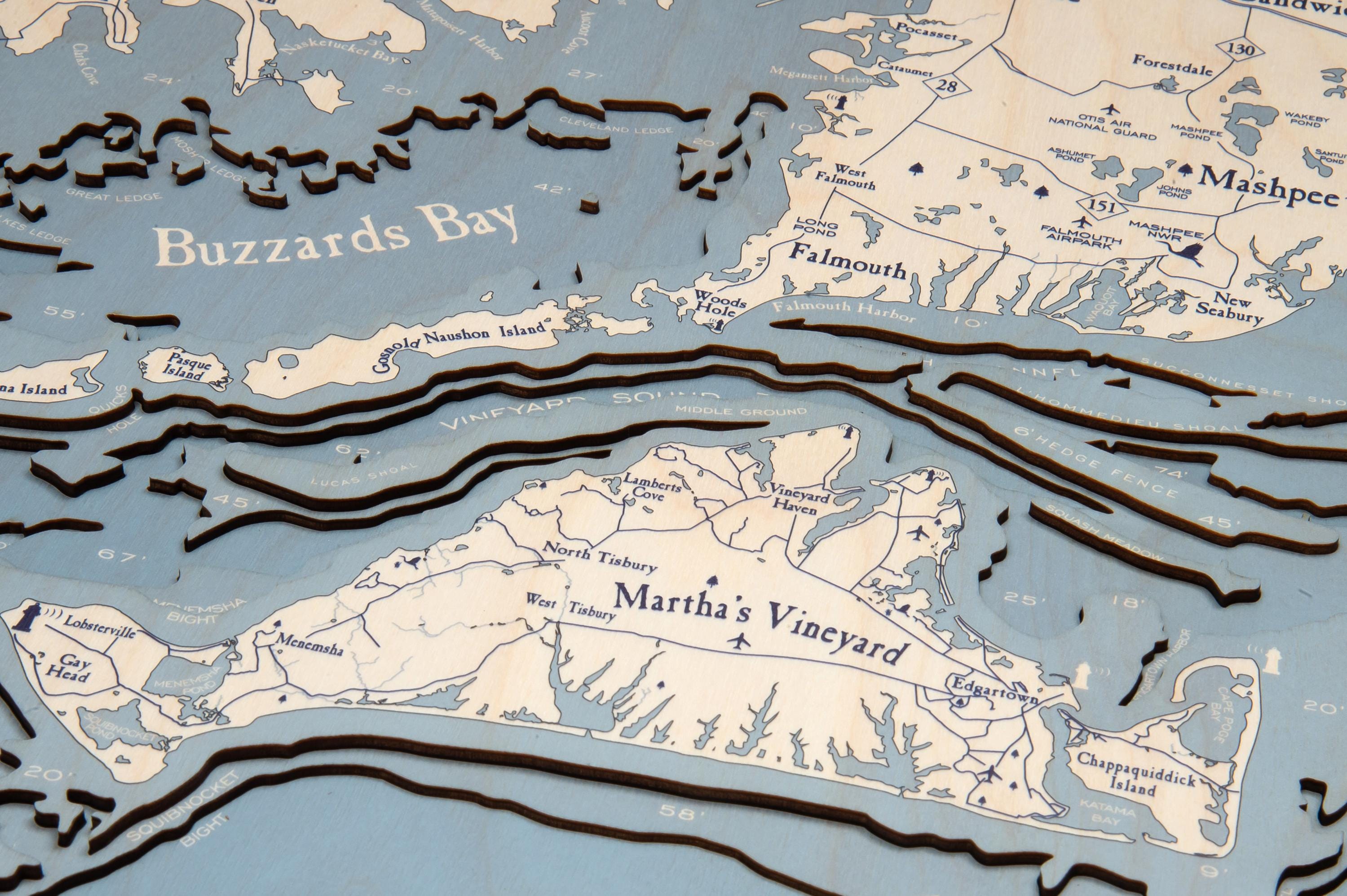 Cape Cod, Massachusetts 3D layered wood map in laser-cut Baltic birch, shown framed against a light wall