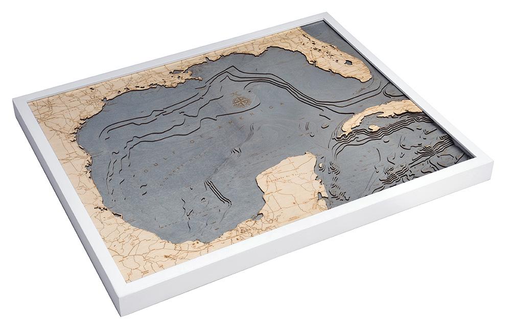 Gulf Of America 3D layered wood map in laser-cut Baltic birch, shown framed against a light wall