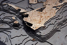 Key West, Florida 3D layered wood map in laser-cut Baltic birch, shown framed against a light wall