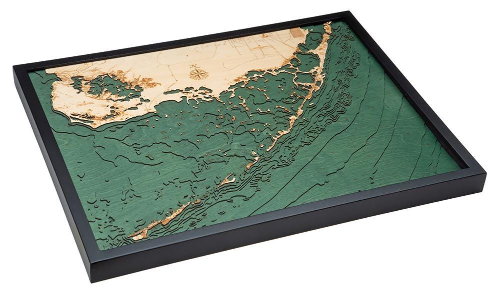 Upper Florida Keys 3D layered wood map in laser-cut Baltic birch, shown framed against a light wall