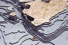 Key West, Florida 3D layered wood map in laser-cut Baltic birch, shown framed against a light wall