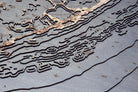Upper Florida Keys 3D layered wood map in laser-cut Baltic birch, shown framed against a light wall