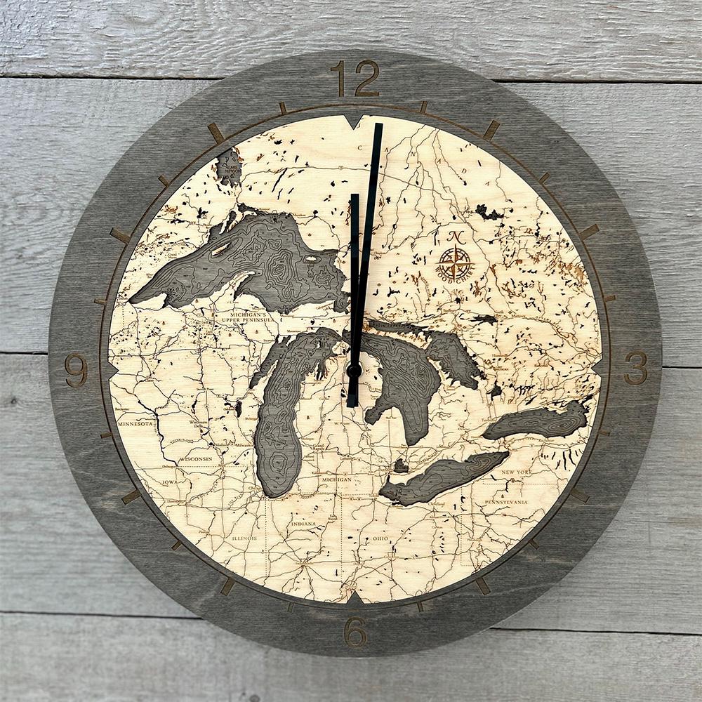 Great Lakes wood wall clock in laser-cut Baltic birch, shown framed against a light wall