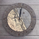 Ponce Inlet, Florida wood tide clock in laser-cut Baltic birch, shown framed against a light wall