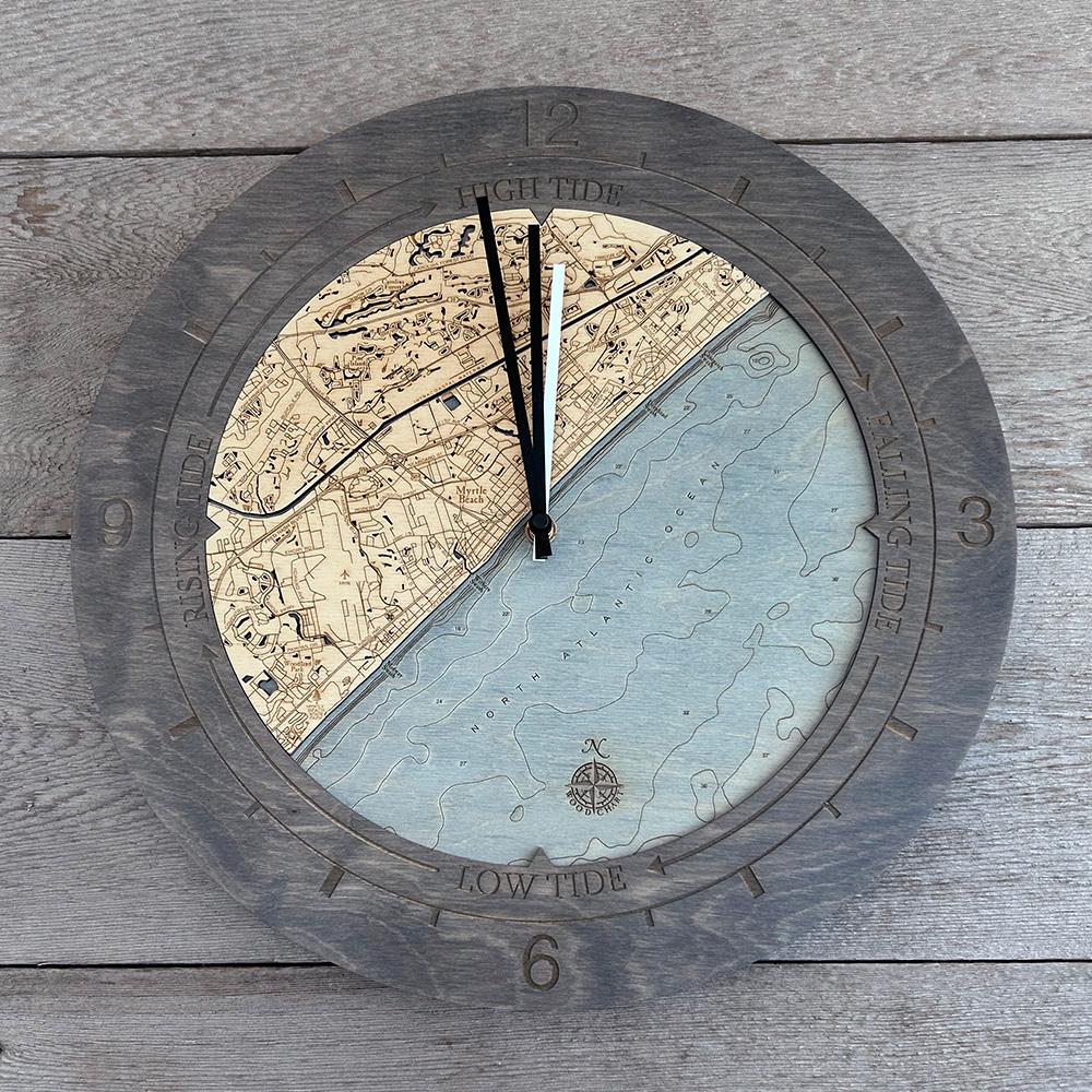 Myrtle Beach, South Carolina wood tide clock in laser-cut Baltic birch, shown framed against a light wall