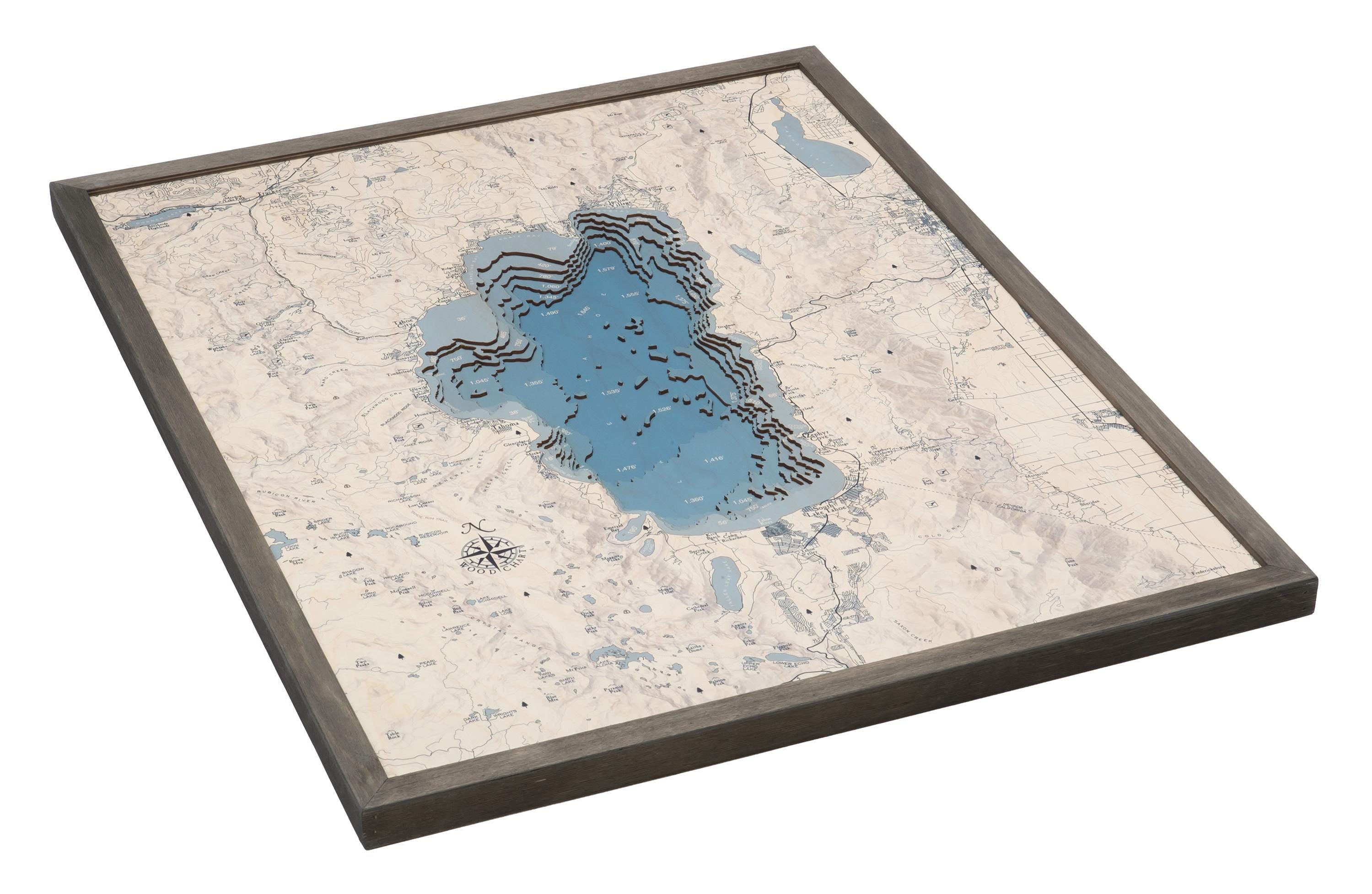 Lake Tahoe, California 3D layered wood map in laser-cut Baltic birch, shown framed against a light wall