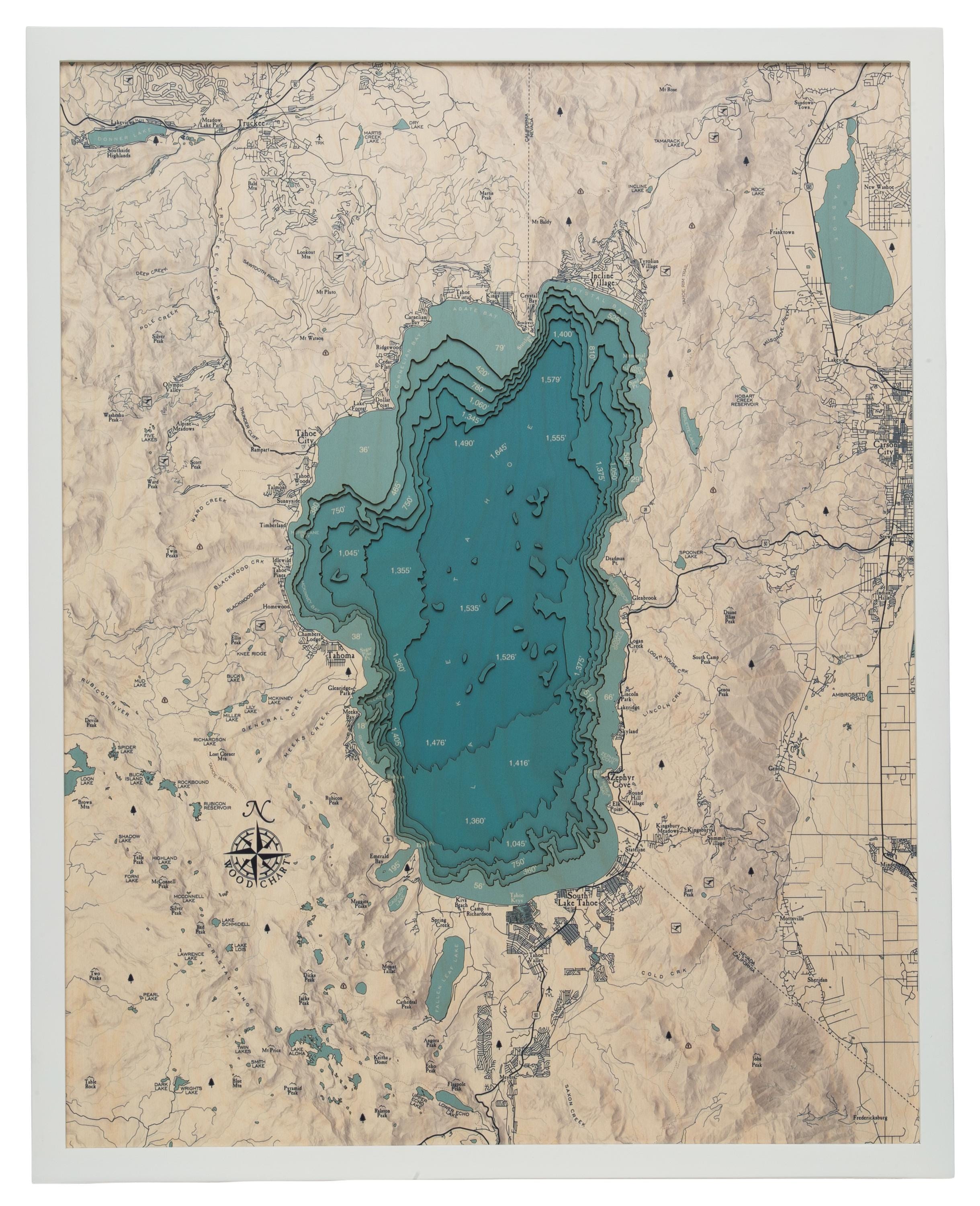 Lake Tahoe, California 3D layered wood map in laser-cut Baltic birch, shown framed against a light wall