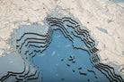 Lake Tahoe, California 3D layered wood map in laser-cut Baltic birch, shown framed against a light wall