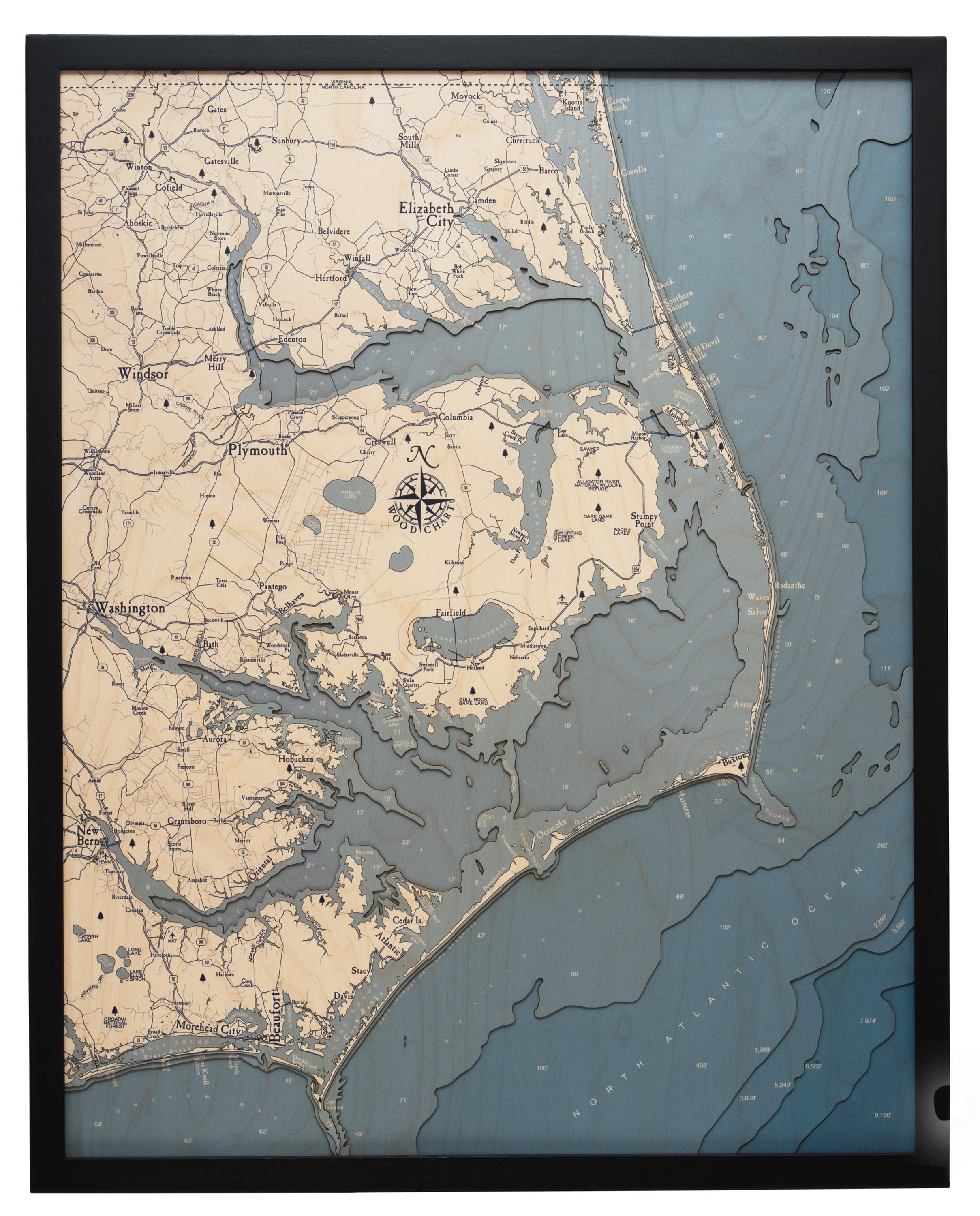 Outer Banks, North Carolina 3D layered wood map in laser-cut Baltic birch, shown framed against a light wall