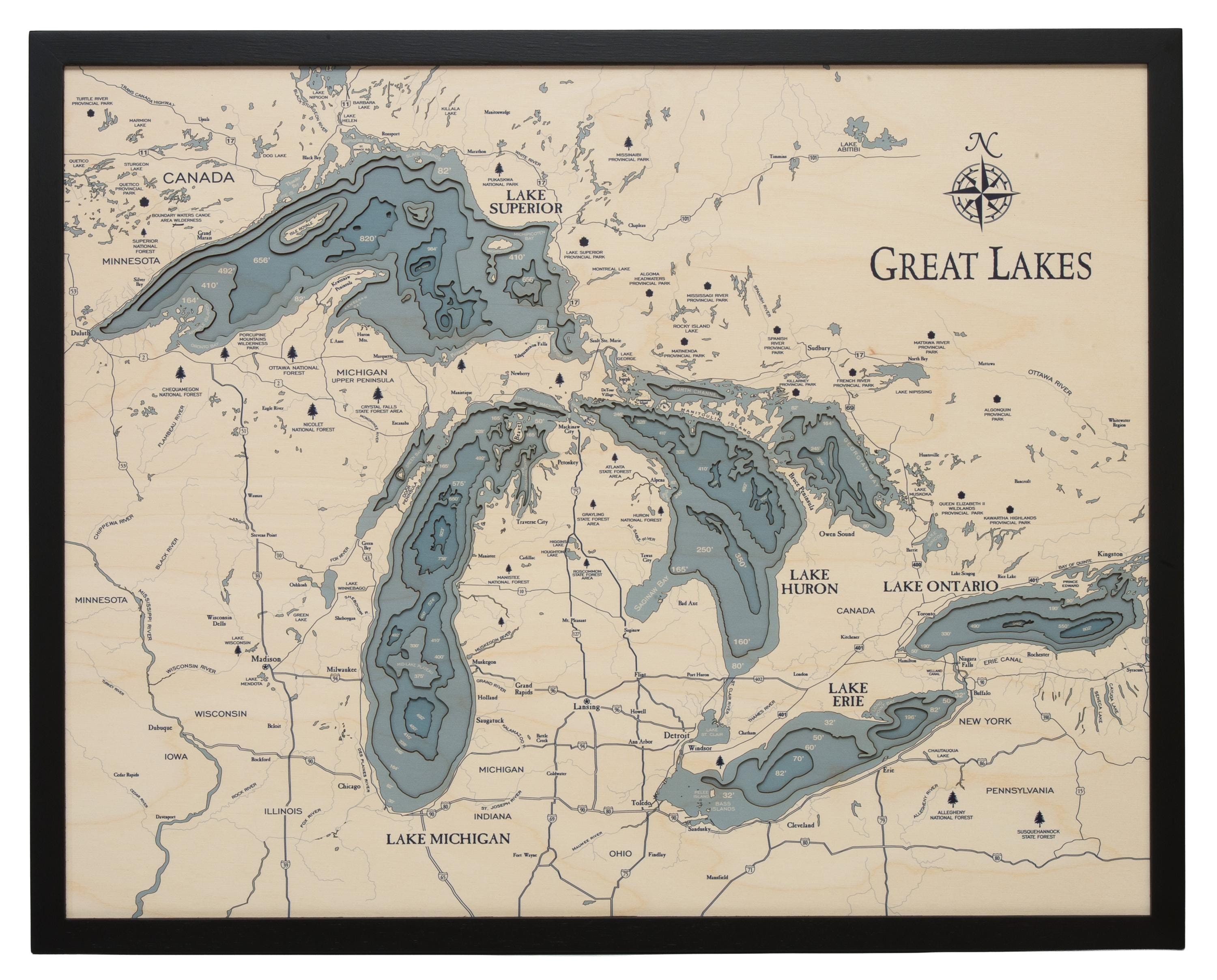 Great Lakes 3D layered wood map in laser-cut Baltic birch, shown framed against a light wall