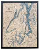 Puget Sound, Washington 3D layered wood map in laser-cut Baltic birch, shown framed against a light wall