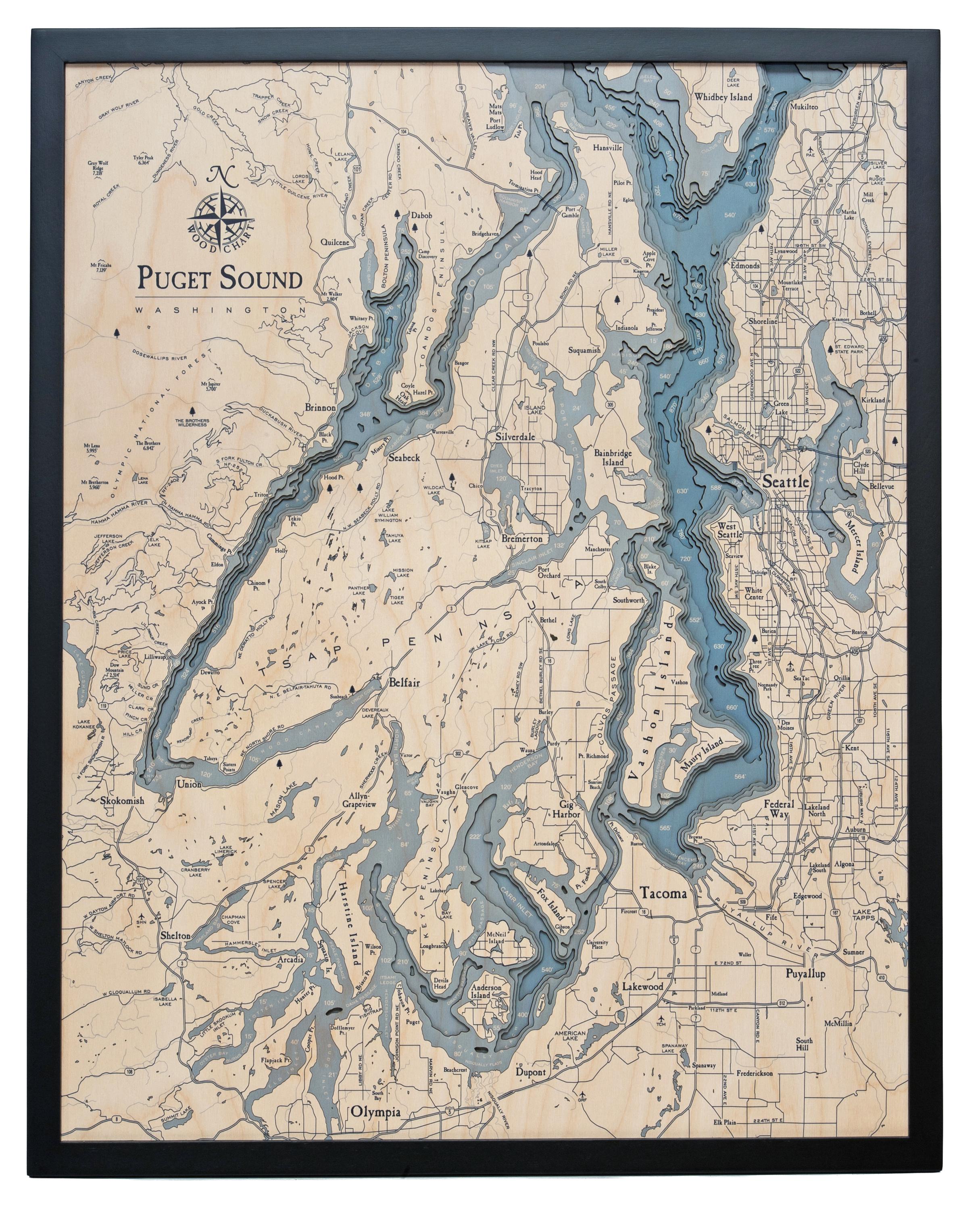 Puget Sound, Washington 3D layered wood map in laser-cut Baltic birch, shown framed against a light wall