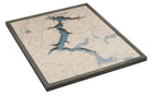 Lake Coeur d'Alene, Idaho 3D layered wood map in laser-cut Baltic birch, shown framed against a light wall