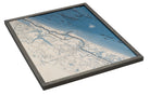 New Smyrna Beach, Florida 3D layered wood map in laser-cut Baltic birch, shown framed against a light wall