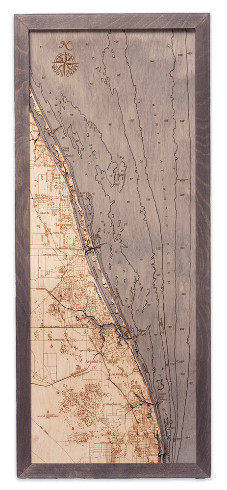 Treasure Coast, Florida 3D layered wood map in laser-cut Baltic birch, shown framed against a light wall
