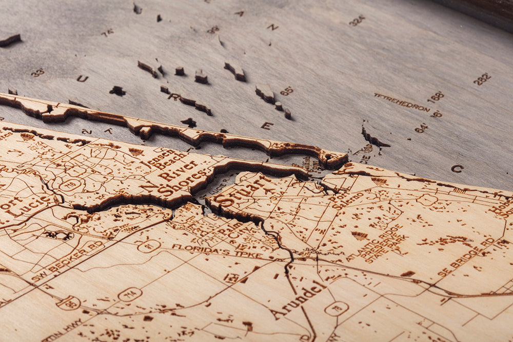 Treasure Coast, Florida 3D layered wood map in laser-cut Baltic birch, shown framed against a light wall
