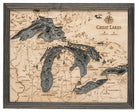 Great Lakes 3D layered wood map in laser-cut Baltic birch, shown framed against a light wall
