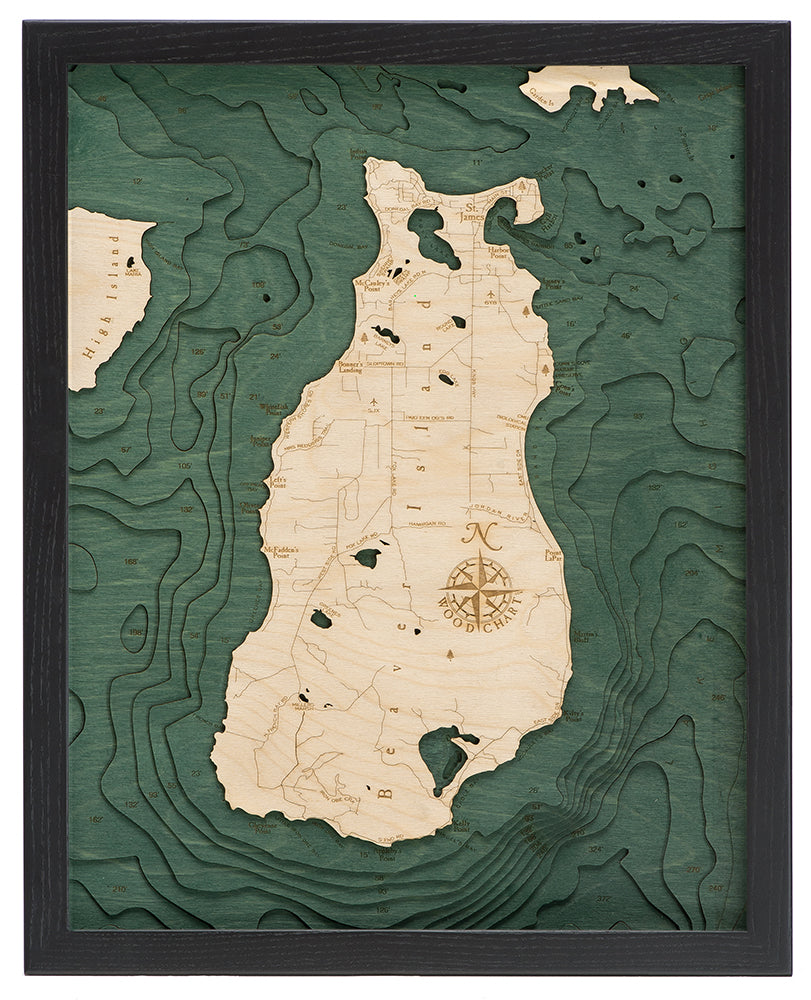 Beaver Island, Michigan 3D layered wood map in laser-cut Baltic birch, shown framed against a light wall