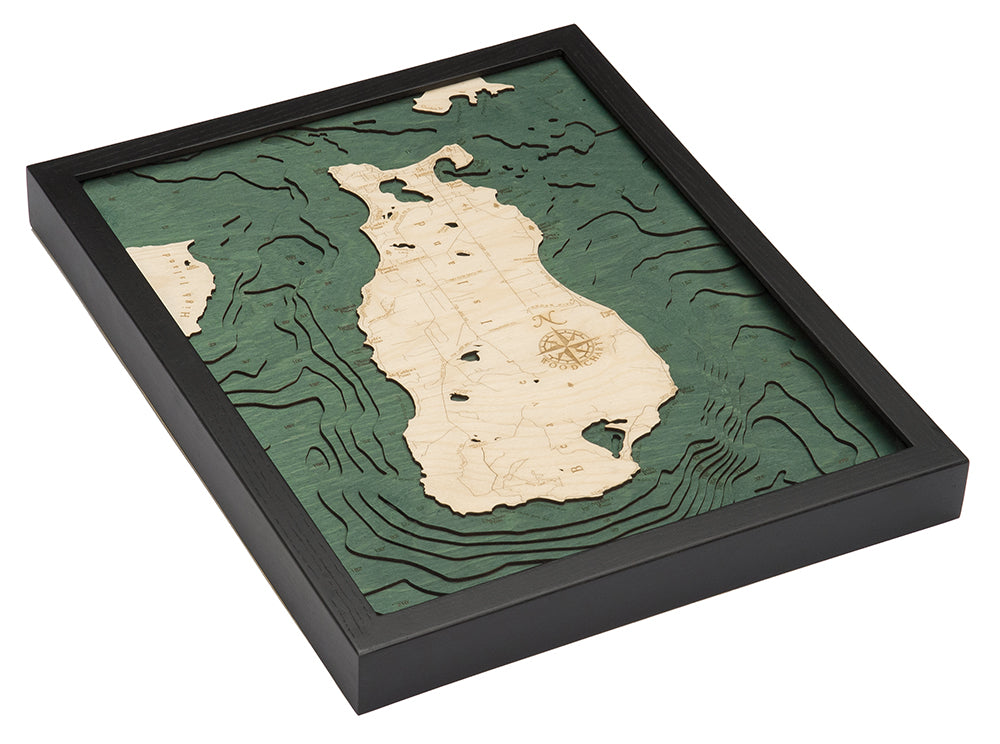 Beaver Island, Michigan 3D layered wood map in laser-cut Baltic birch, shown framed against a light wall