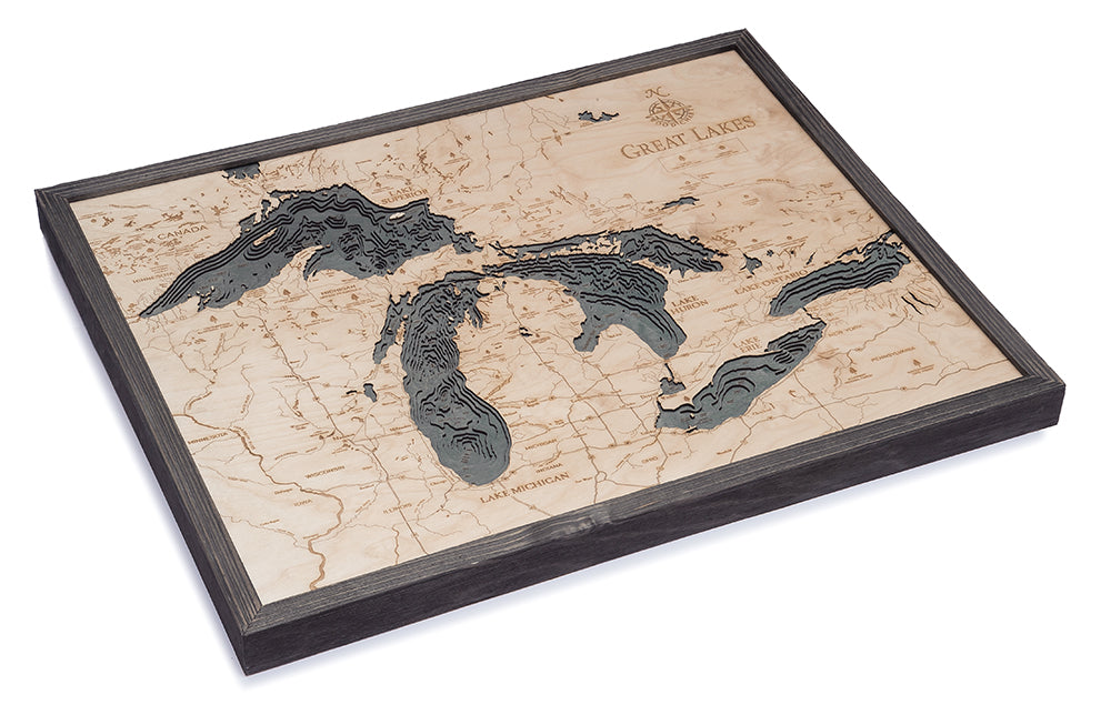 Great Lakes 3D layered wood map in laser-cut Baltic birch, shown framed against a light wall