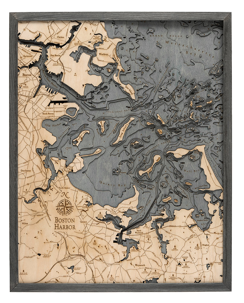 Boston Harbor, Massachusetts 3D layered wood map in laser-cut Baltic birch, shown framed against a light wall