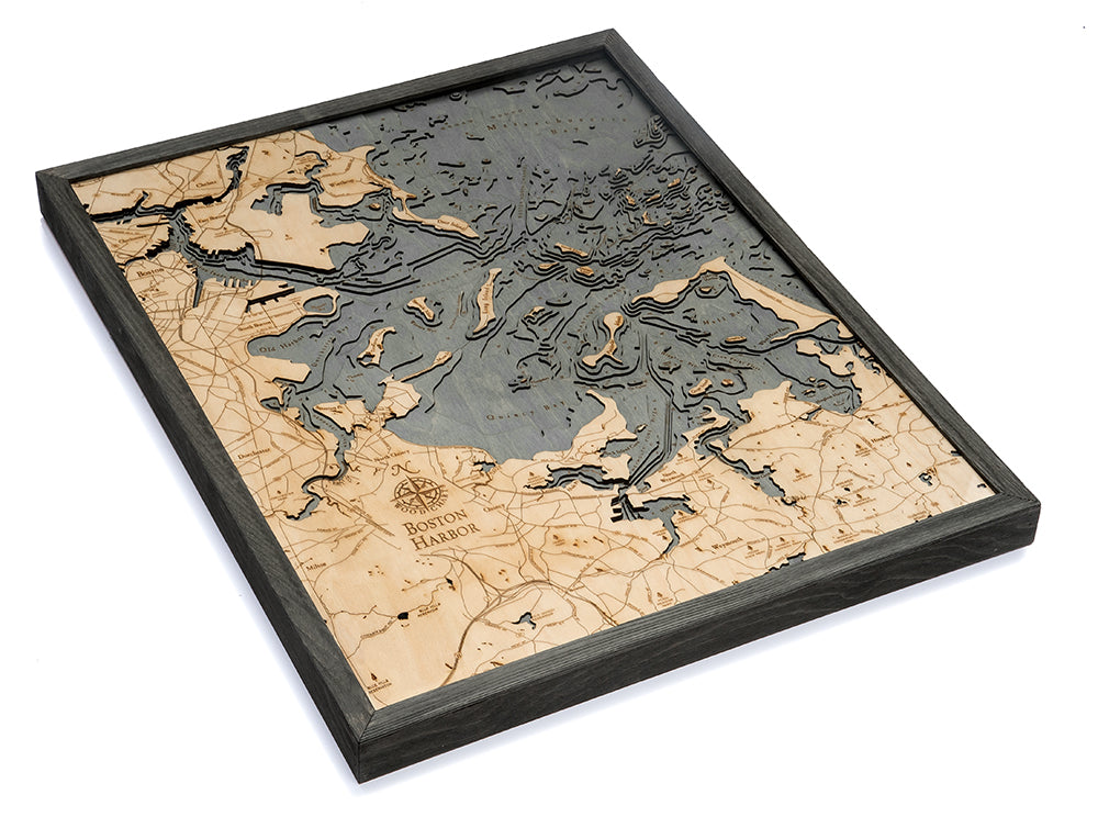 Boston Harbor, Massachusetts 3D layered wood map in laser-cut Baltic birch, shown framed against a light wall