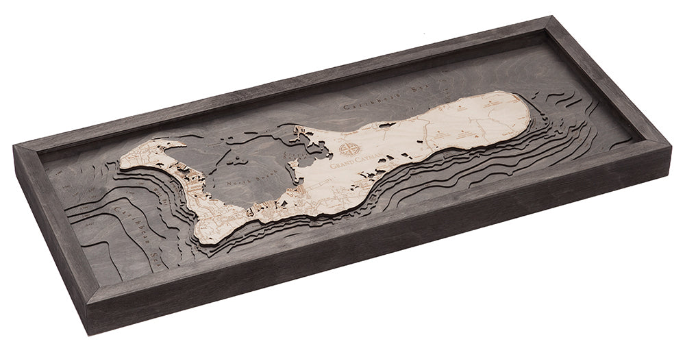 Grand Cayman, Caribbean 3D layered wood map in laser-cut Baltic birch, shown framed against a light wall