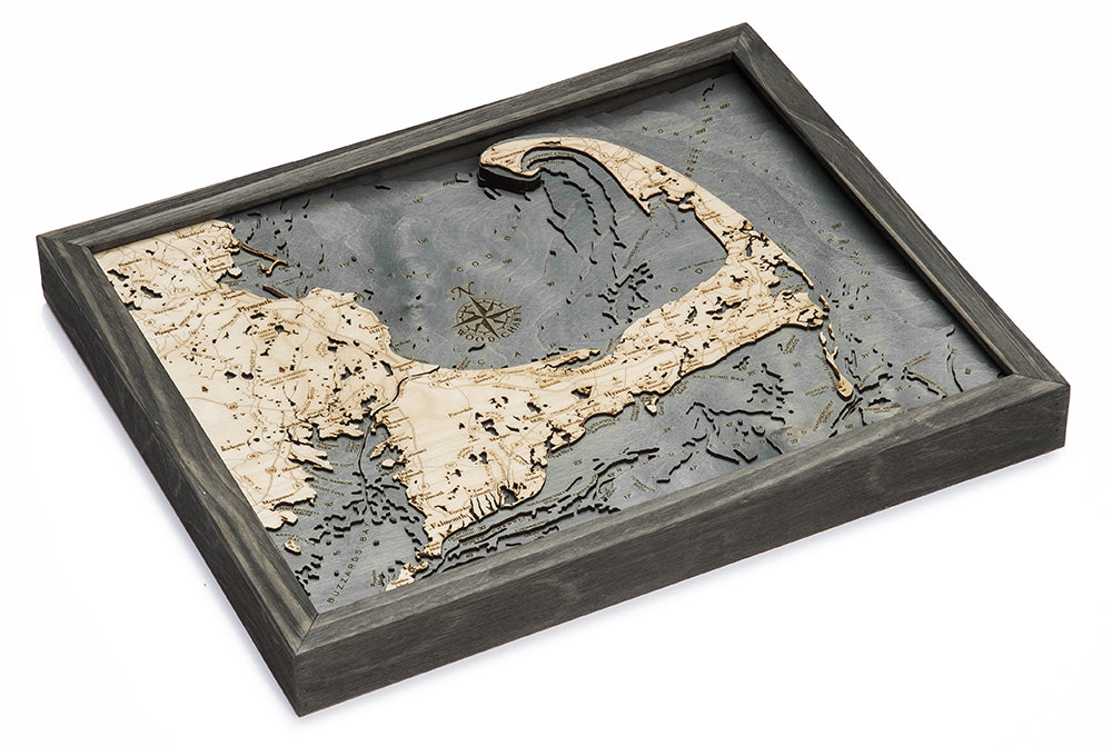 Cape Cod, Massachusetts 3D layered wood map in laser-cut Baltic birch, shown framed against a light wall
