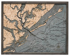 Charleston, South Carolina 3D layered wood map in laser-cut Baltic birch, shown framed against a light wall