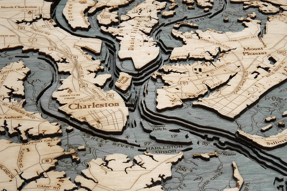 Charleston, South Carolina 3D layered wood map in laser-cut Baltic birch, shown framed against a light wall